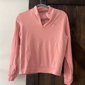 A peach colored vineyard vines quarter zip